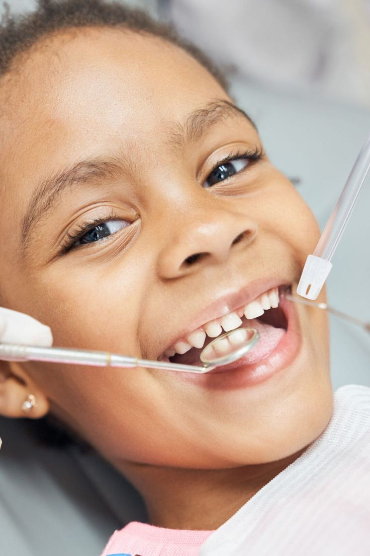 Child smiling after a dental check-up in Mombasa